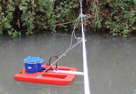 Photograph of the StreamPro being deployed in the included tethered boat on a temporary tagline.