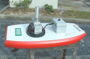 Photograph of custom boogie board configured by John Shelton for deploying an ADCP, profile view with all equipment.